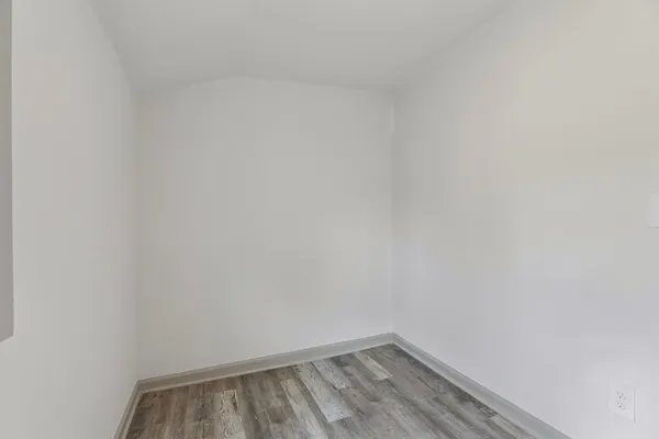 a bathroom with a granite countertop sink a toilet and a mirror