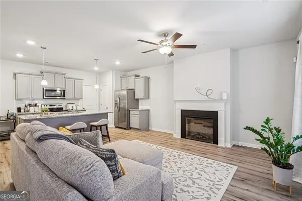 a living room with furniture and a fireplace