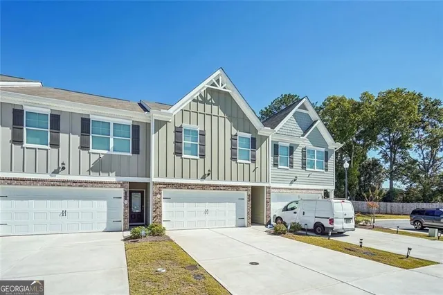 a front view of a building with many windows