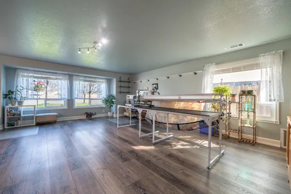 a room with furniture and a wooden floor