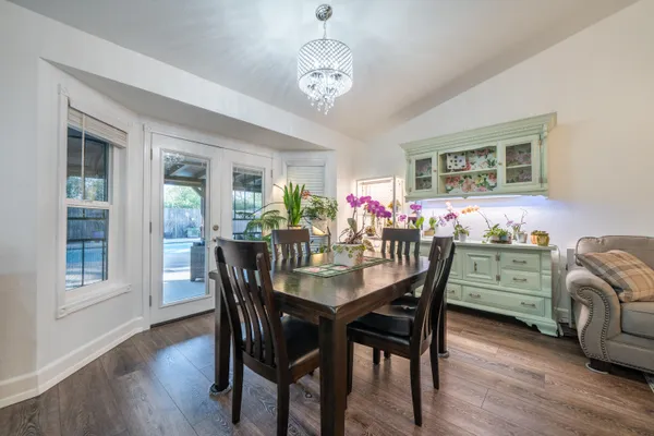 a kitchen with granite countertop kitchen island white cabinets and a sink