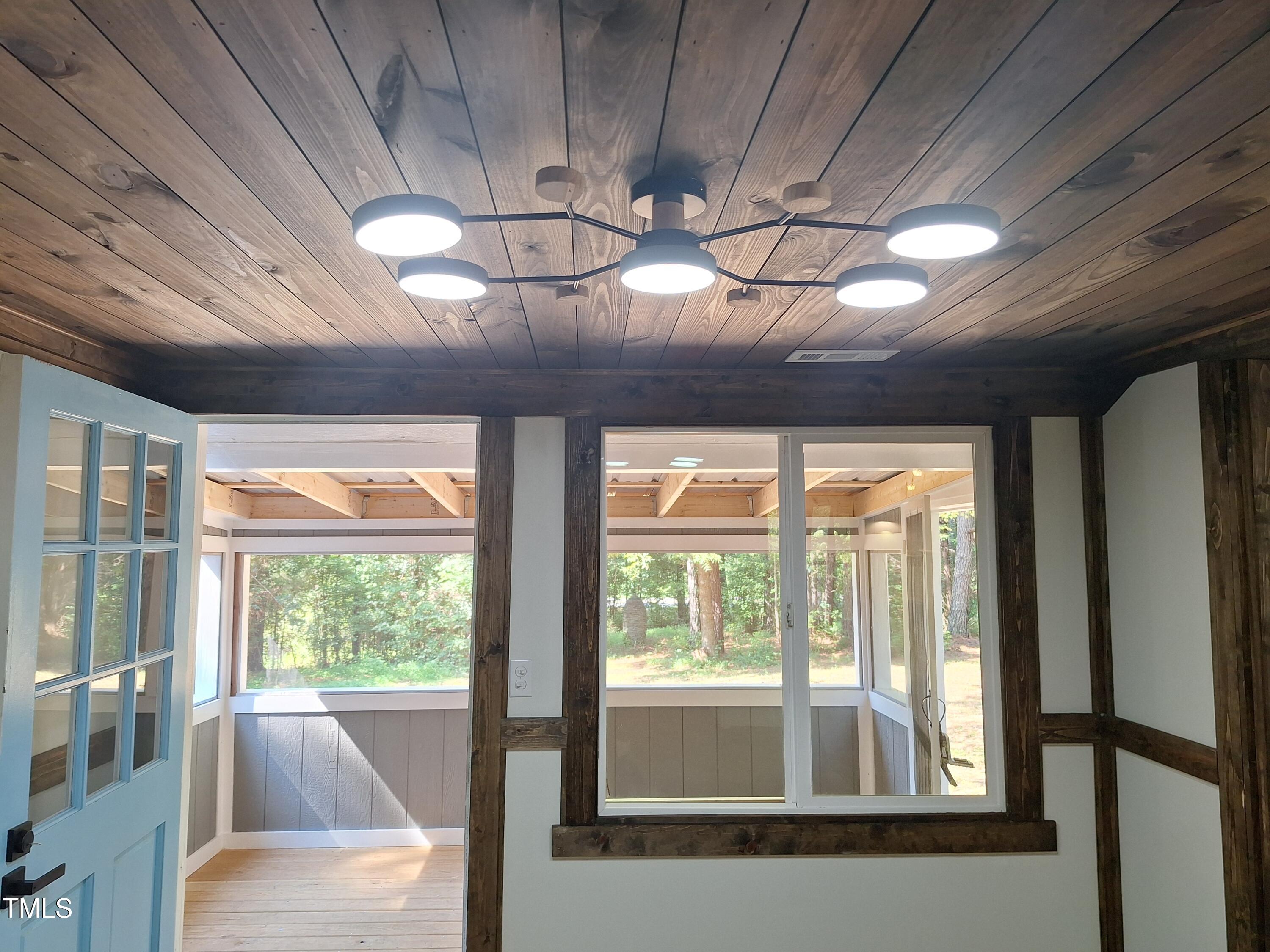 12 Nota Road Moncure, NC 27559 - Photo 13 of 30 a view of a room that has a bed and large windows