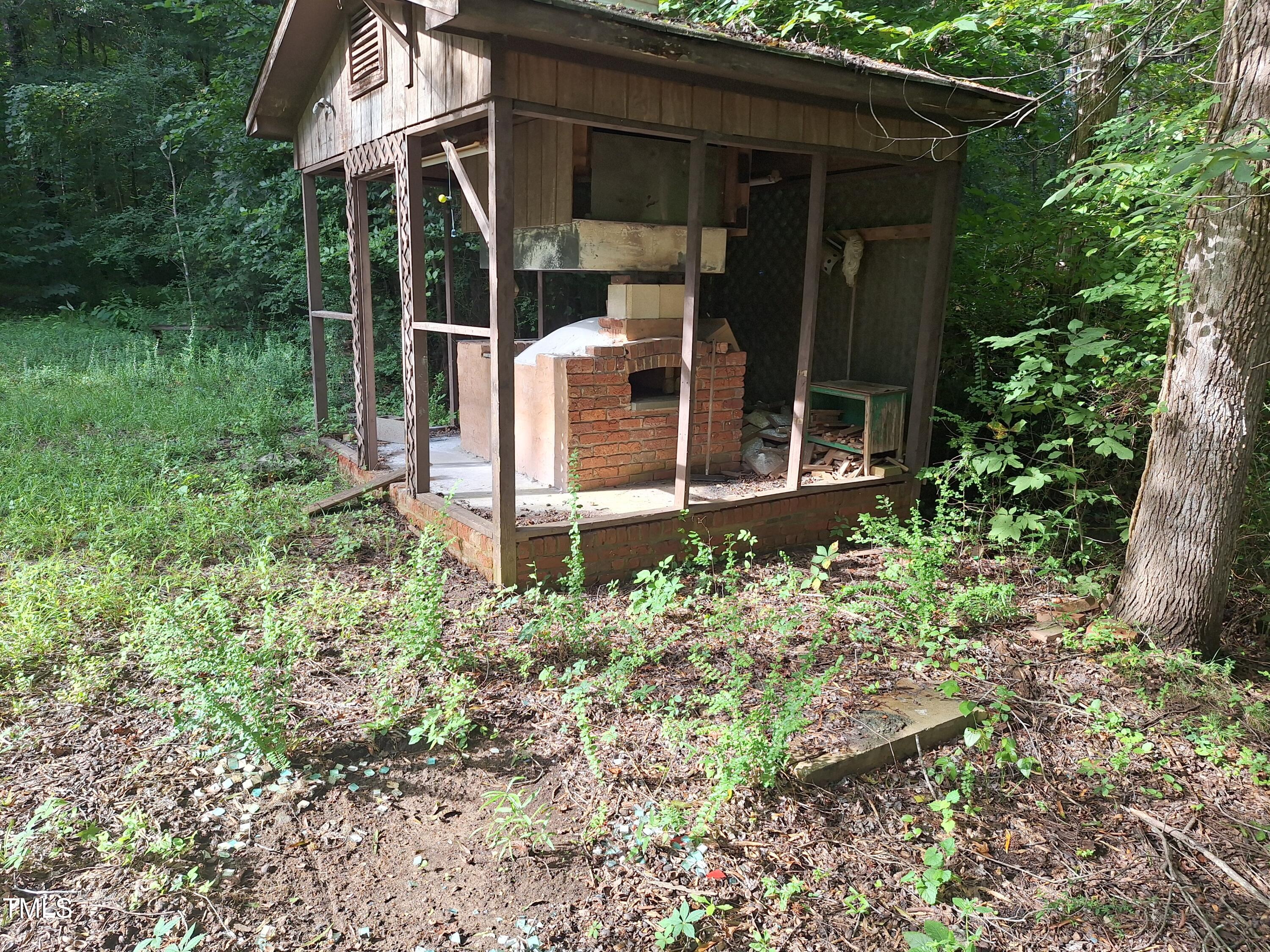 12 Nota Road Moncure, NC 27559 - Photo 17 of 30 a backyard of a house with lots of green space