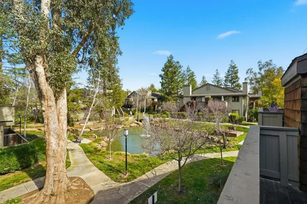 a view of a lake with a house in the background