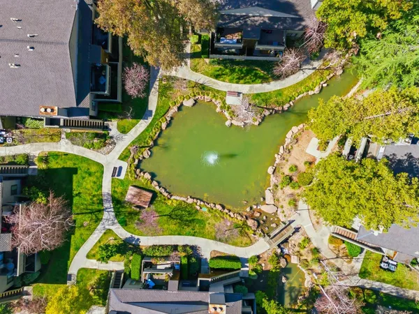 an aerial view of a house with a yard and garden view