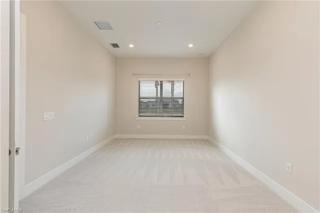 a view of a room with white walls