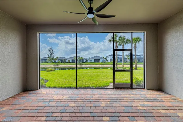 a view of a lake with houses in the background