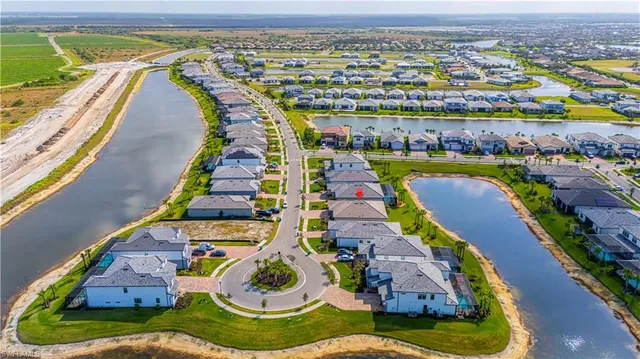 an aerial view of a house with a ocean view