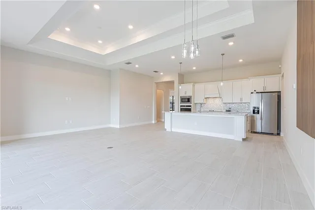 a view of an empty room with glass door