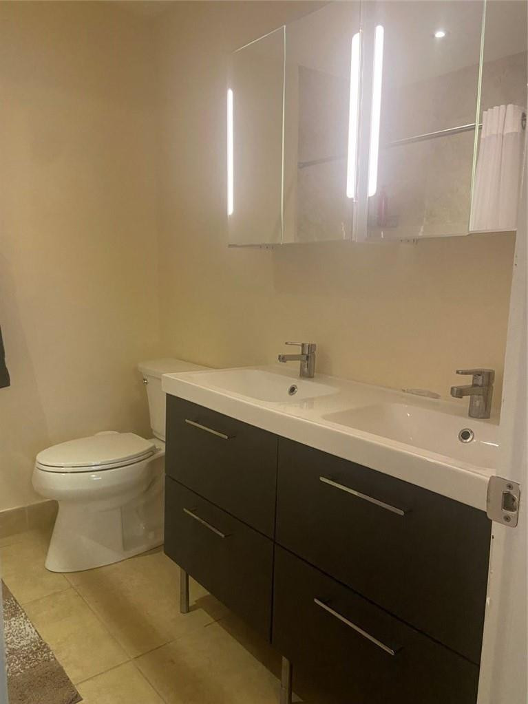 1501 Northwest 13th Street, Unit 14 Boca Raton, FL 33486 - Photo 11 of 16 Primary Bathroom w/ double sinks