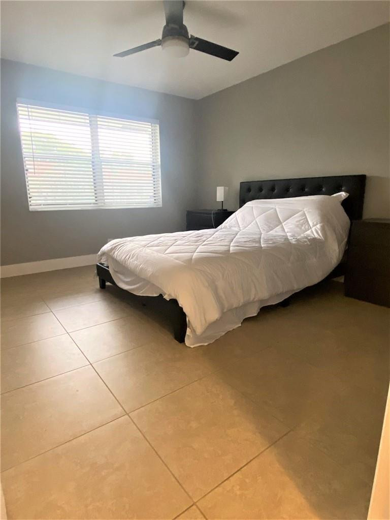 1501 Northwest 13th Street, Unit 14 Boca Raton, FL 33486 - Photo 7 of 16 Guest Bedroom w/ walk-in closet