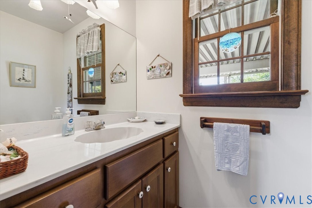 15414 Sunnybrook Road Petersburg, VA 23805 - Photo 18 of 29 a bathroom with a sink and a mirror