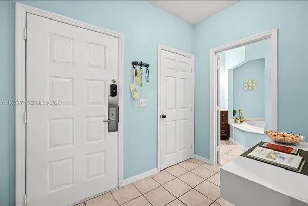 a bedroom with double bed and a window