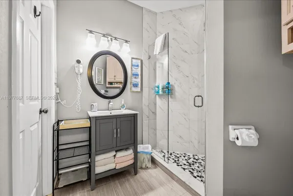 a living room with furniture and a large window with outer view