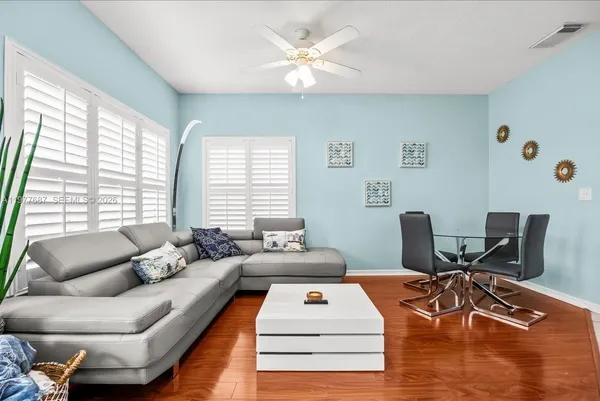 a kitchen with stainless steel appliances a stove a sink and a microwave