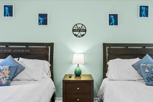 a bedroom with a bed and a table in it