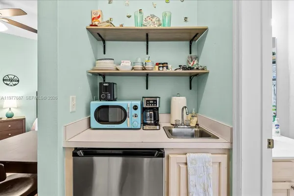 a kitchen with a stove and a sink