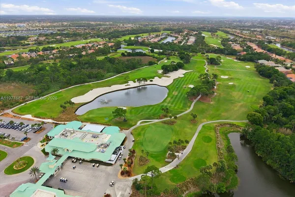 an aerial view of a residential houses with outdoor space