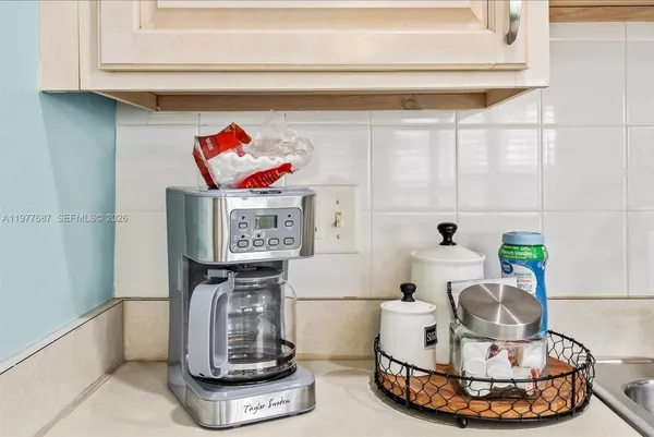 a room with a fireplace and gym equipment