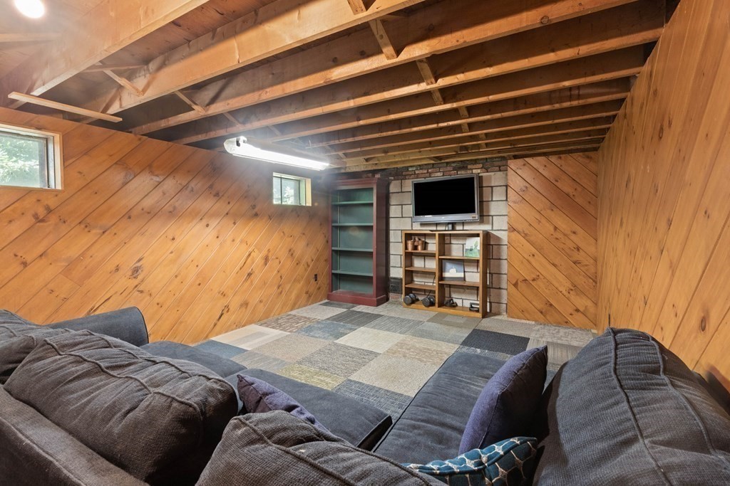 105 Valley Road Boxford, MA 01921 - Photo 23 of 41 a bedroom with a bed and a chair