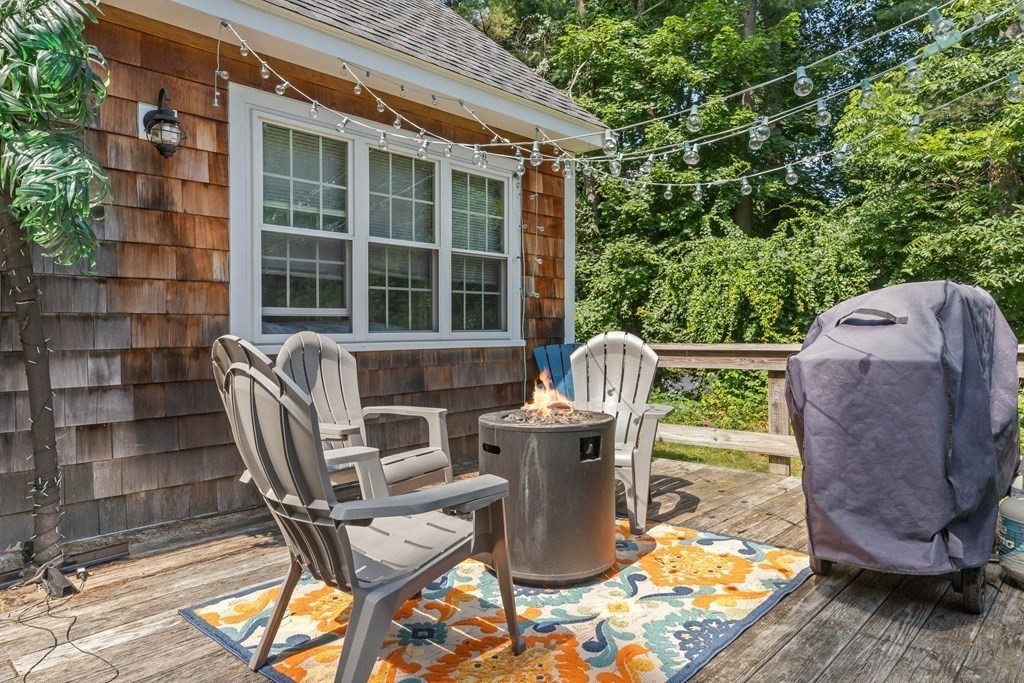 105 Valley Road Boxford, MA 01921 - Photo 26 of 41 a view of a chairs and table in the patio