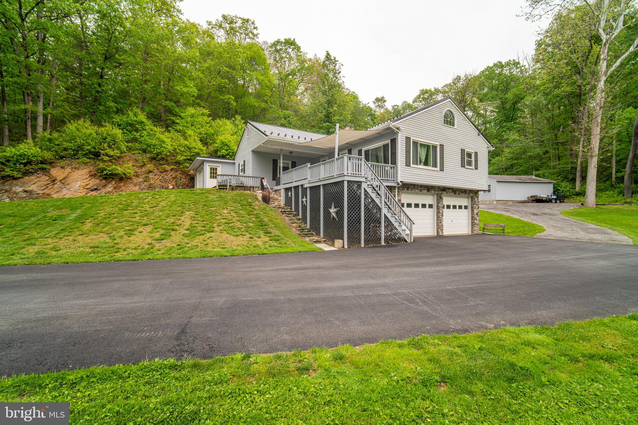 13127 Manor Furnace Road Brogue, PA 17309 - Photo 9 of 78 a view of a white house with a yard and sitting area