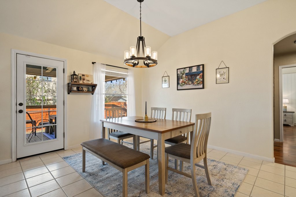 2305 Candle Ridge Trail Georgetown, TX 78626 - Photo 16 of 40 Dining room with arched walkways, lofted ceiling, and light tile patterned flooring