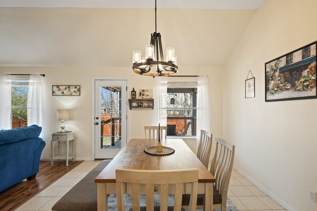 2305 Candle Ridge Trail Georgetown, TX 78626 - Photo 19 of 40 Dining room with light tile patterned floors, hanging lights, and lofted ceiling