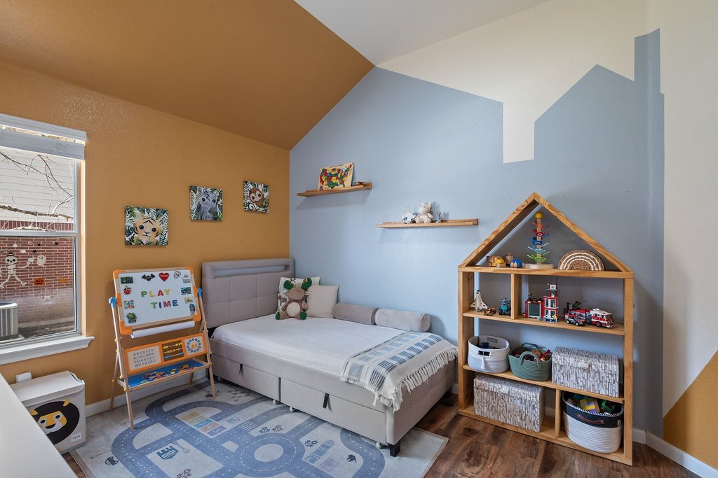 2305 Candle Ridge Trail Georgetown, TX 78626 - Photo 28 of 40 Bedroom with lofted ceiling and dark wood finished floors