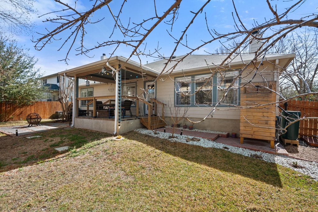 2305 Candle Ridge Trail Georgetown, TX 78626 - Photo 32 of 40 Back of house with a wooden deck, an outdoor fire pit, and a chimney