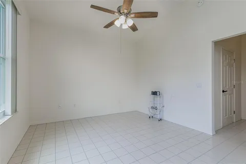 wooden floor in a hall with a window