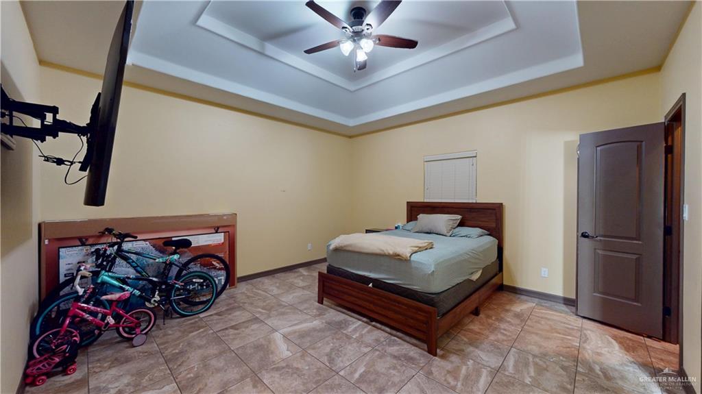 731 North Tower Road Alamo, TX 78516 - Photo 18 of 28 a living room with furniture and a chandelier