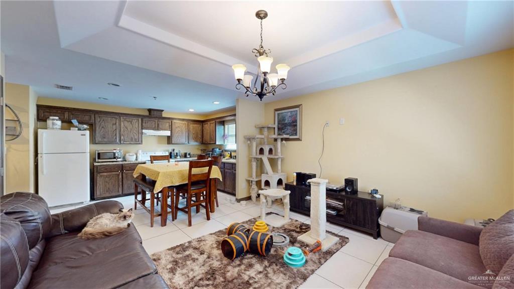 731 North Tower Road Alamo, TX 78516 - Photo 22 of 28 a living room with lots of furniture and kitchen view