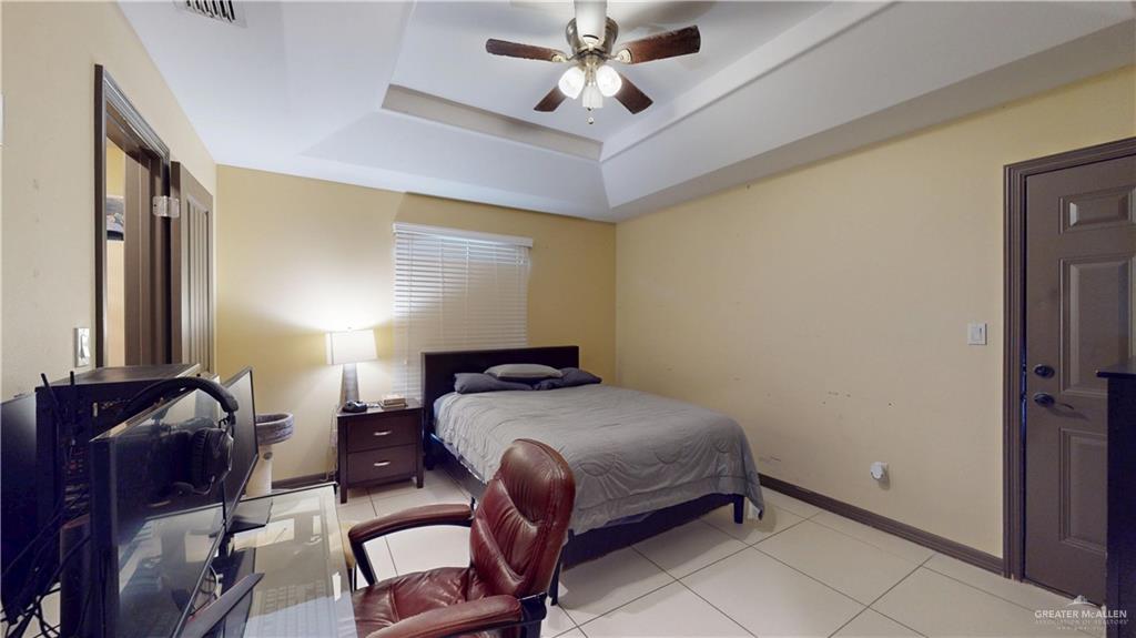 731 North Tower Road Alamo, TX 78516 - Photo 25 of 28 a bedroom with a bed and window