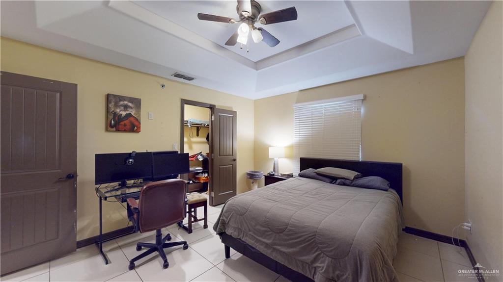 731 North Tower Road Alamo, TX 78516 - Photo 26 of 28 a bedroom with a bed and a desk