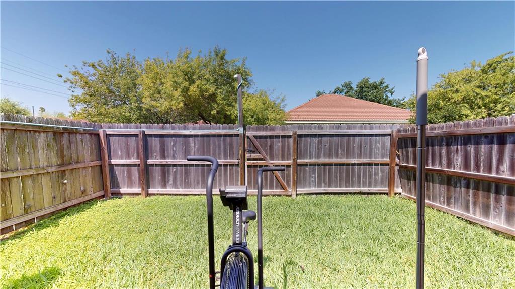 731 North Tower Road Alamo, TX 78516 - Photo 27 of 28 a view of backyard with small cabin and wooden fence