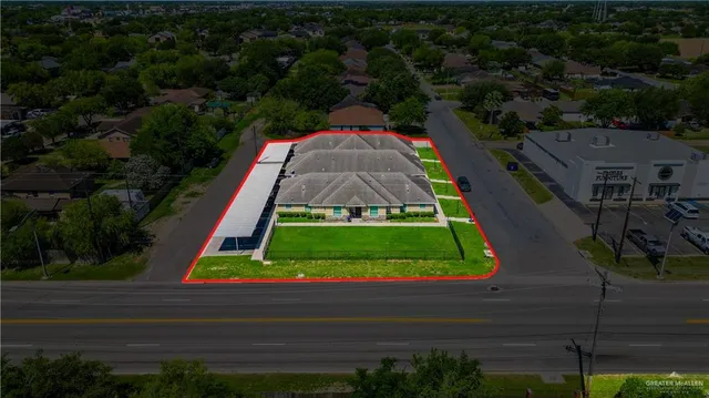 front view of house with potted plants