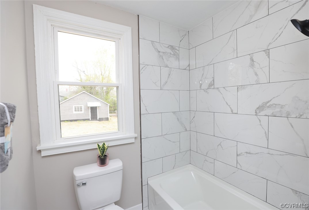 2305 Wright Avenue Richmond, VA 23224 - Photo 16 of 33 a bath room with a toilet a bath tub and a shower
