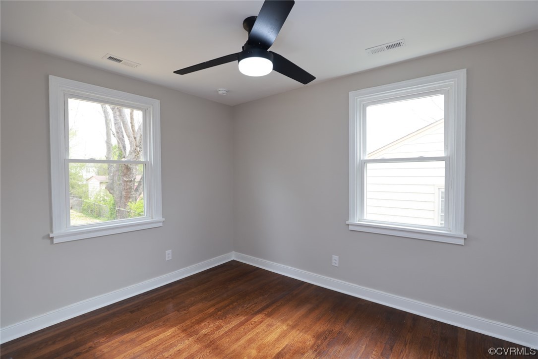 2305 Wright Avenue Richmond, VA 23224 - Photo 18 of 33 a view of an empty room with wooden floor and a window