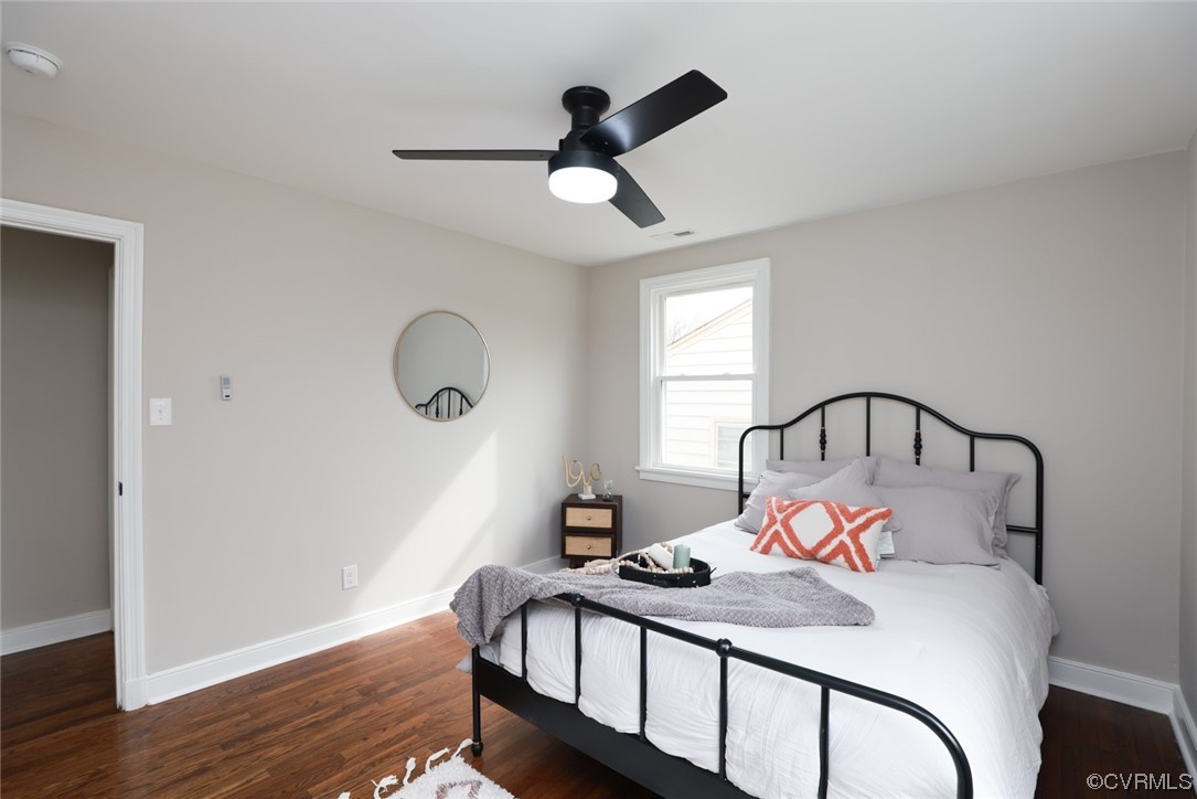 2305 Wright Avenue Richmond, VA 23224 - Photo 19 of 33 a bedroom with bed and a chandelier