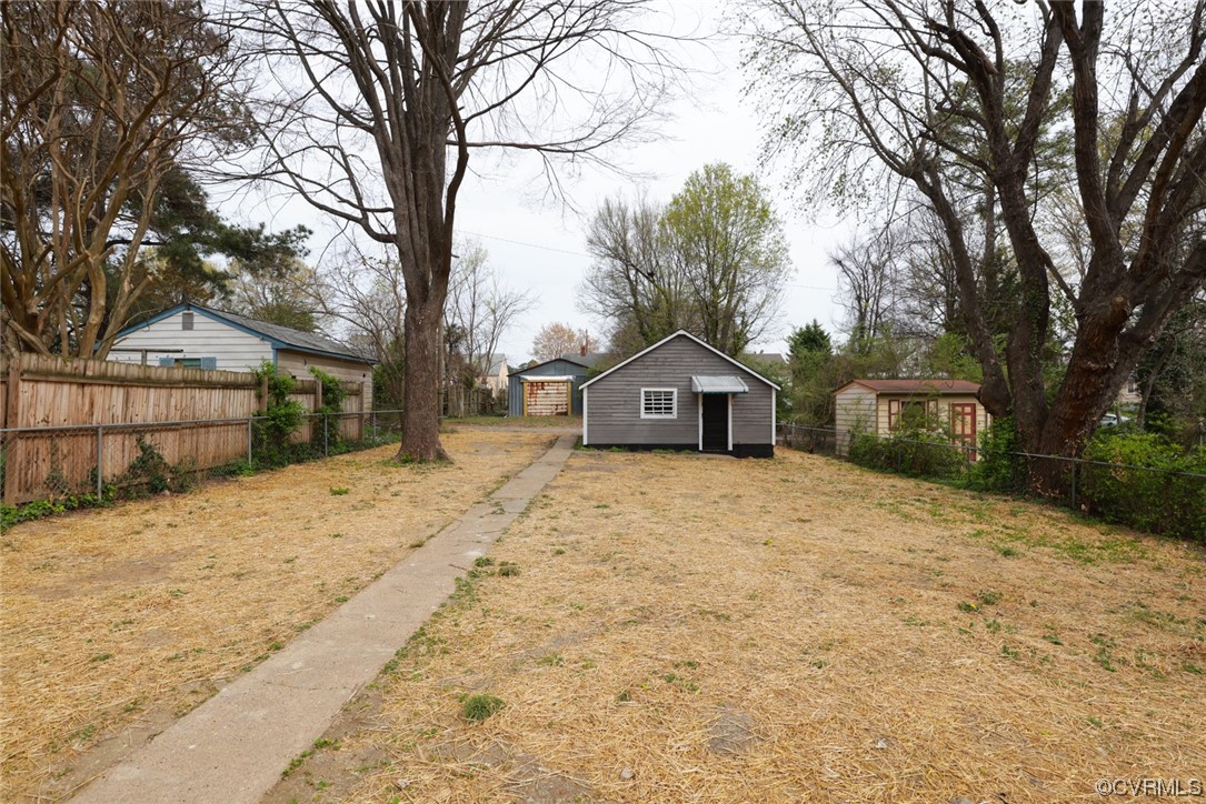 2305 Wright Avenue Richmond, VA 23224 - Photo 25 of 33 a front view of a house with a yard covered in snow