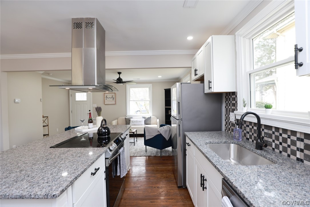 2305 Wright Avenue Richmond, VA 23224 - Photo 7 of 33 a kitchen with stainless steel appliances granite countertop a sink stove and cabinets