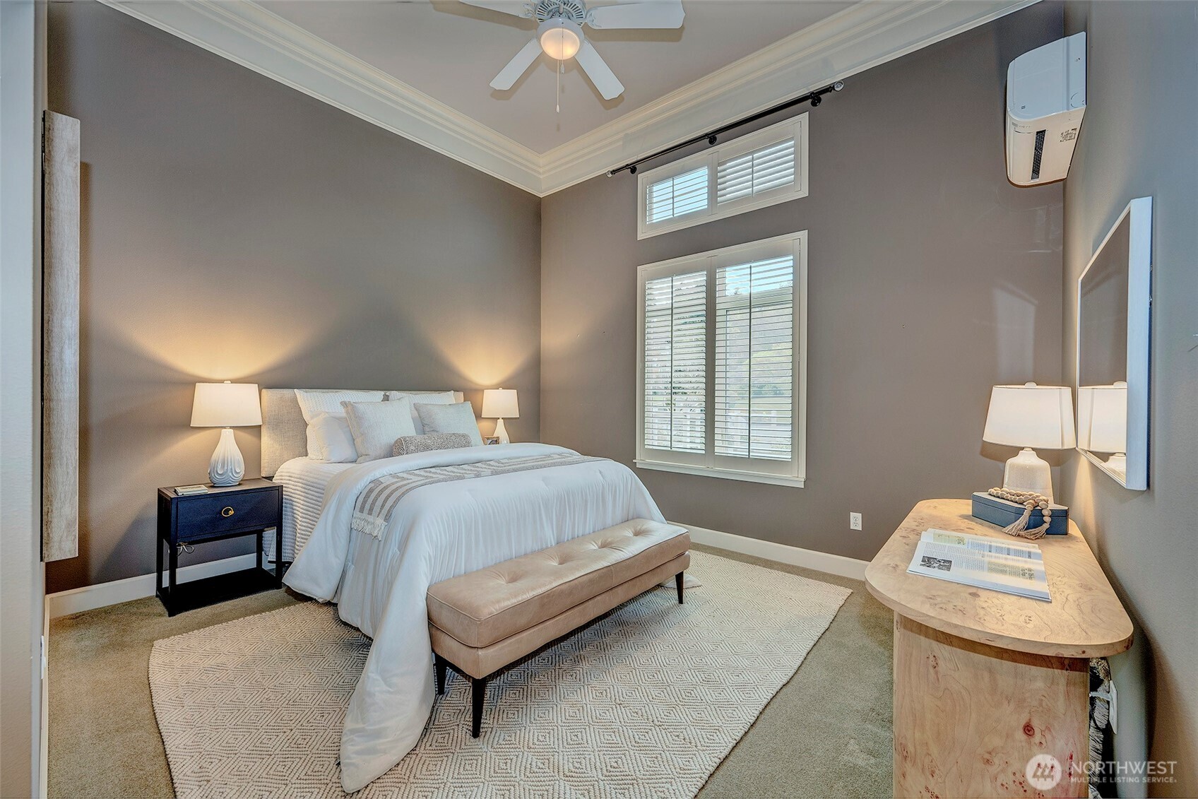 61 Pine Street, Unit 201 Edmonds, WA 98020 - Photo 15 of 34 a bedroom with a bed and a table in it