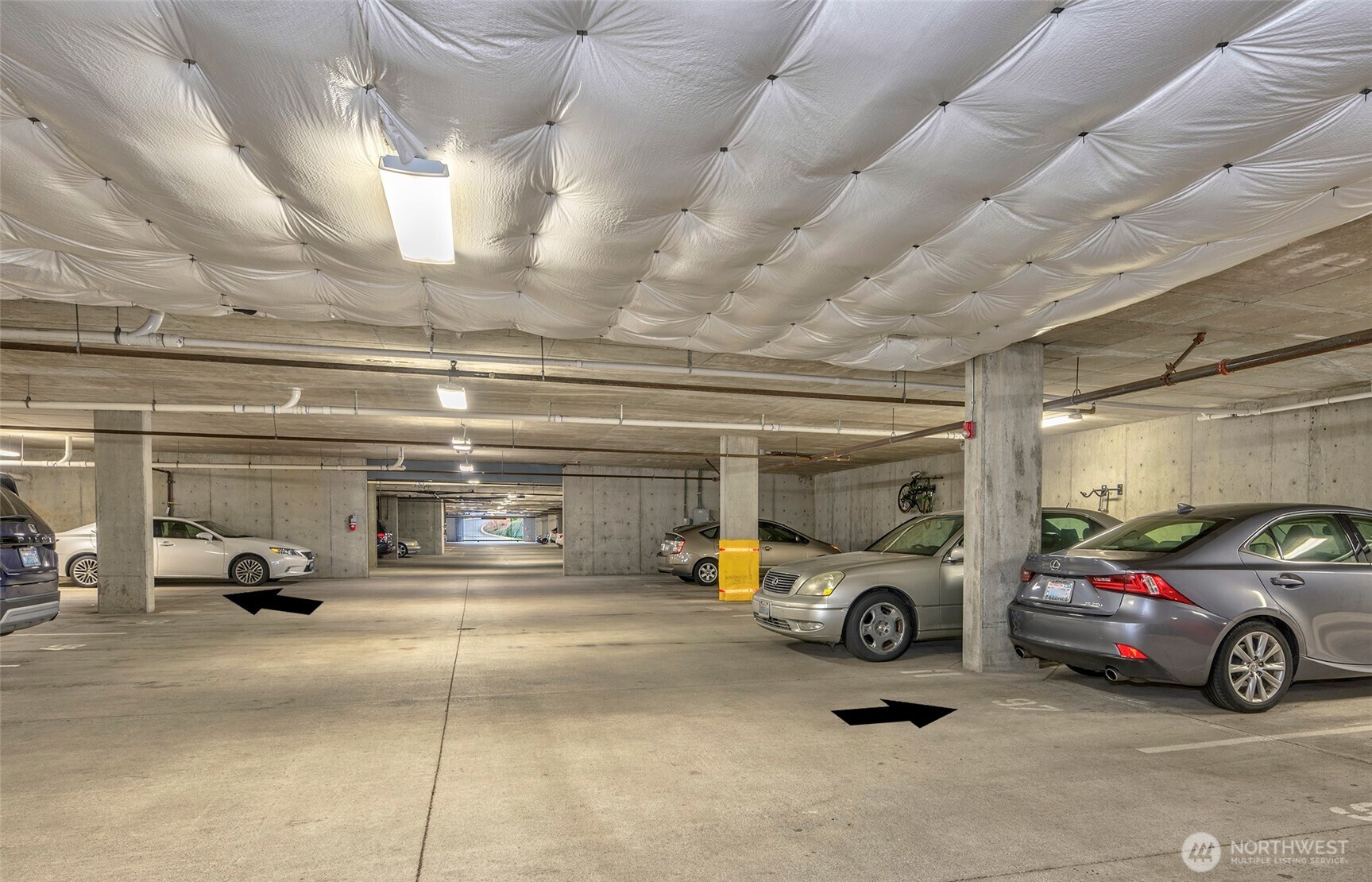 61 Pine Street, Unit 201 Edmonds, WA 98020 - Photo 21 of 34 a view of parking garage with cars