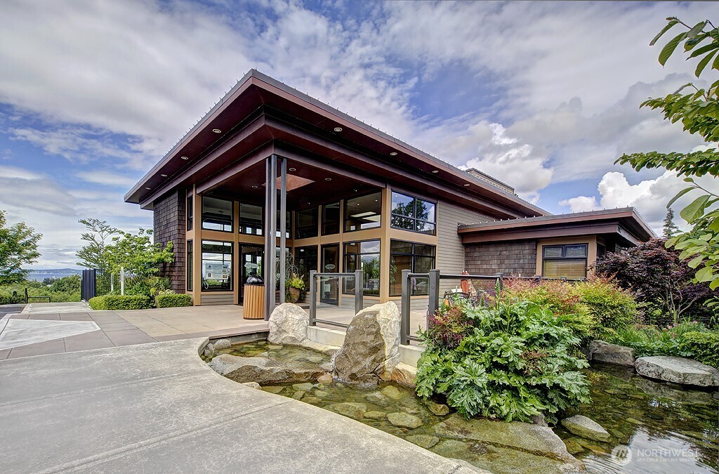 61 Pine Street, Unit 201 Edmonds, WA 98020 - Photo 24 of 34 a front view of a house with a porch