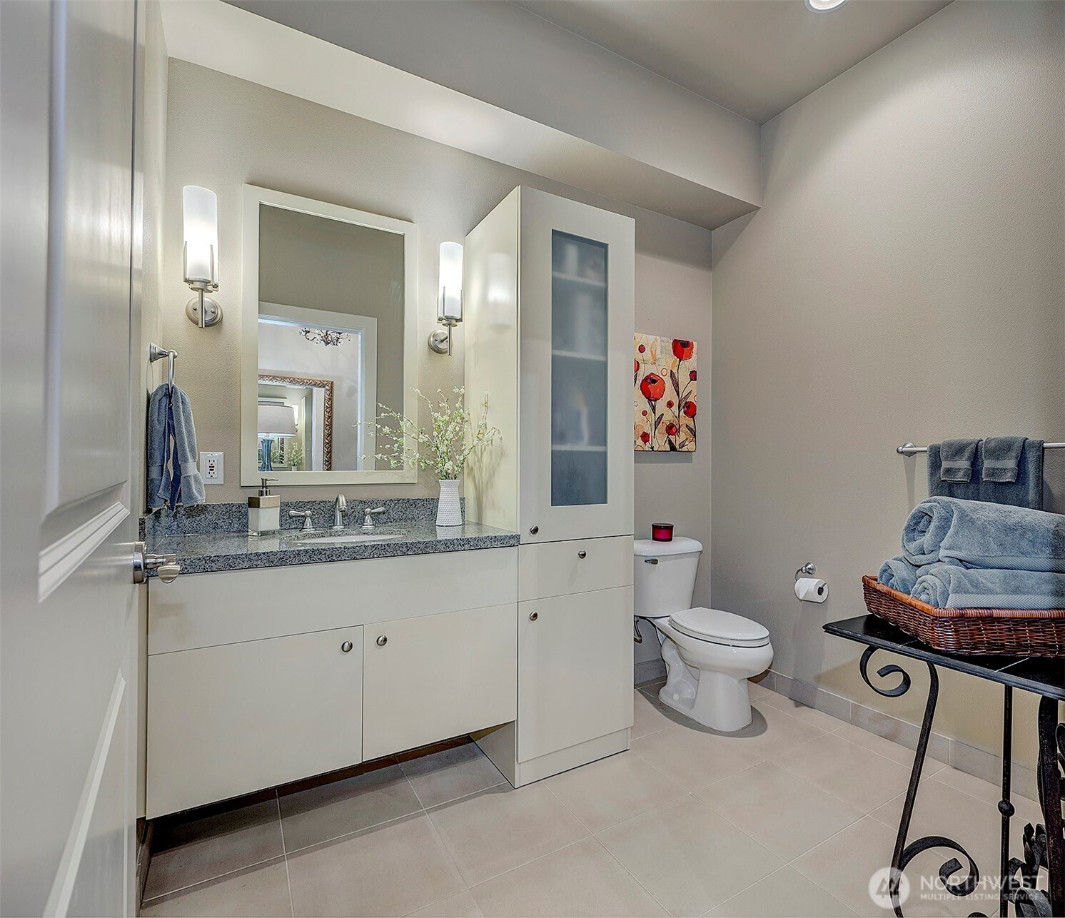 61 Pine Street, Unit 201 Edmonds, WA 98020 - Photo 5 of 34 a spacious bathroom with a sink mirror vanity and toilet