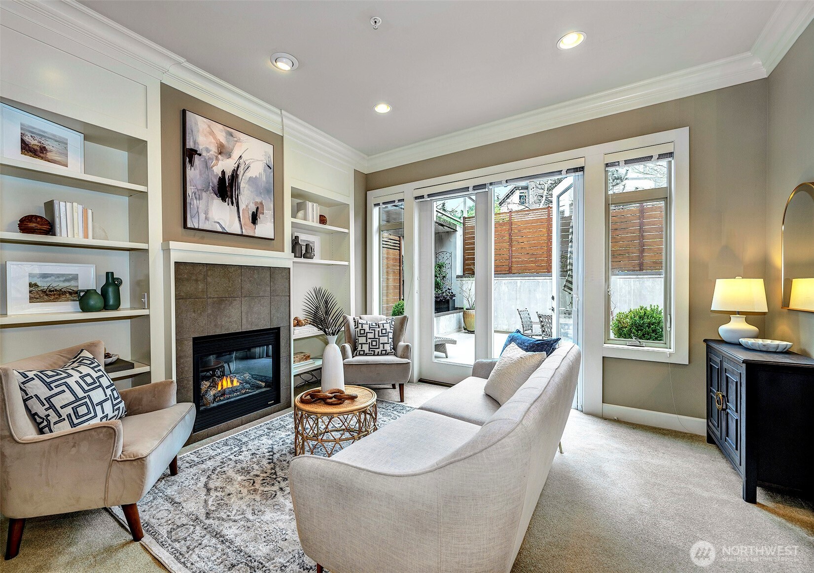 61 Pine Street, Unit 201 Edmonds, WA 98020 - Photo 9 of 34 a living room with furniture large window and a fireplace