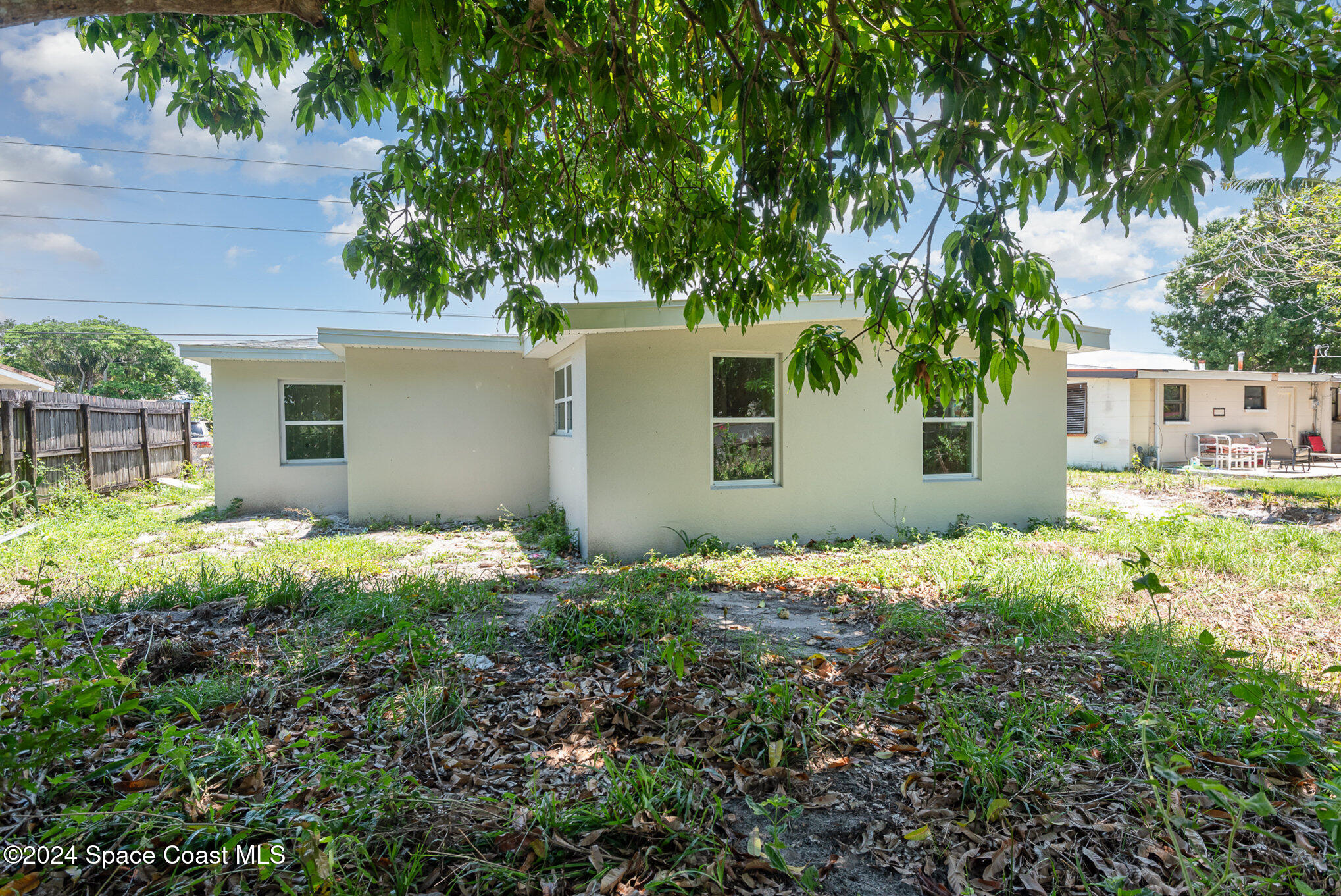 2626 Sarno Road Melbourne, FL 32935 - Photo 24 of 24 front view of house with a yard
