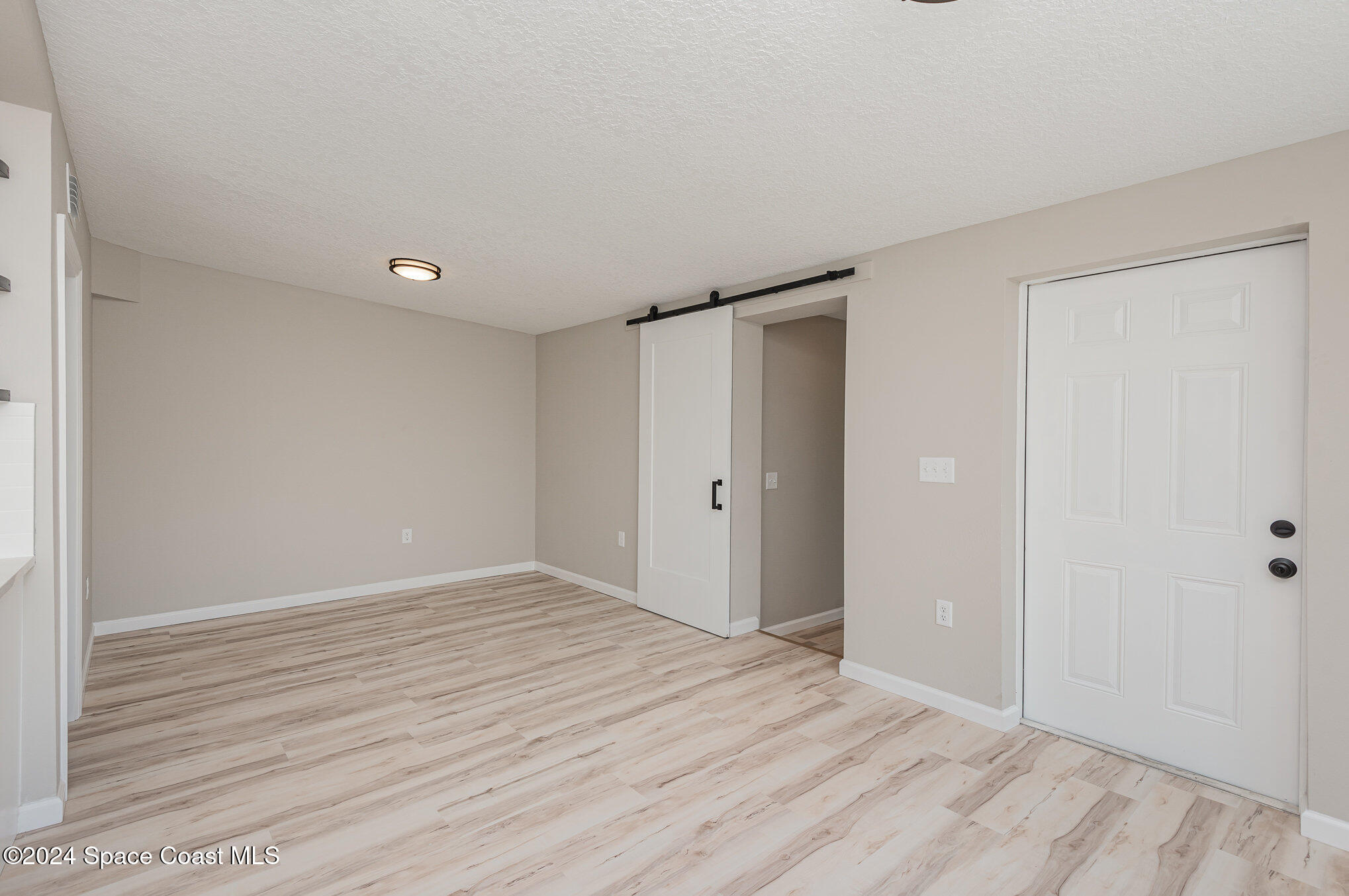 2626 Sarno Road Melbourne, FL 32935 - Photo 4 of 24 a view of an empty room