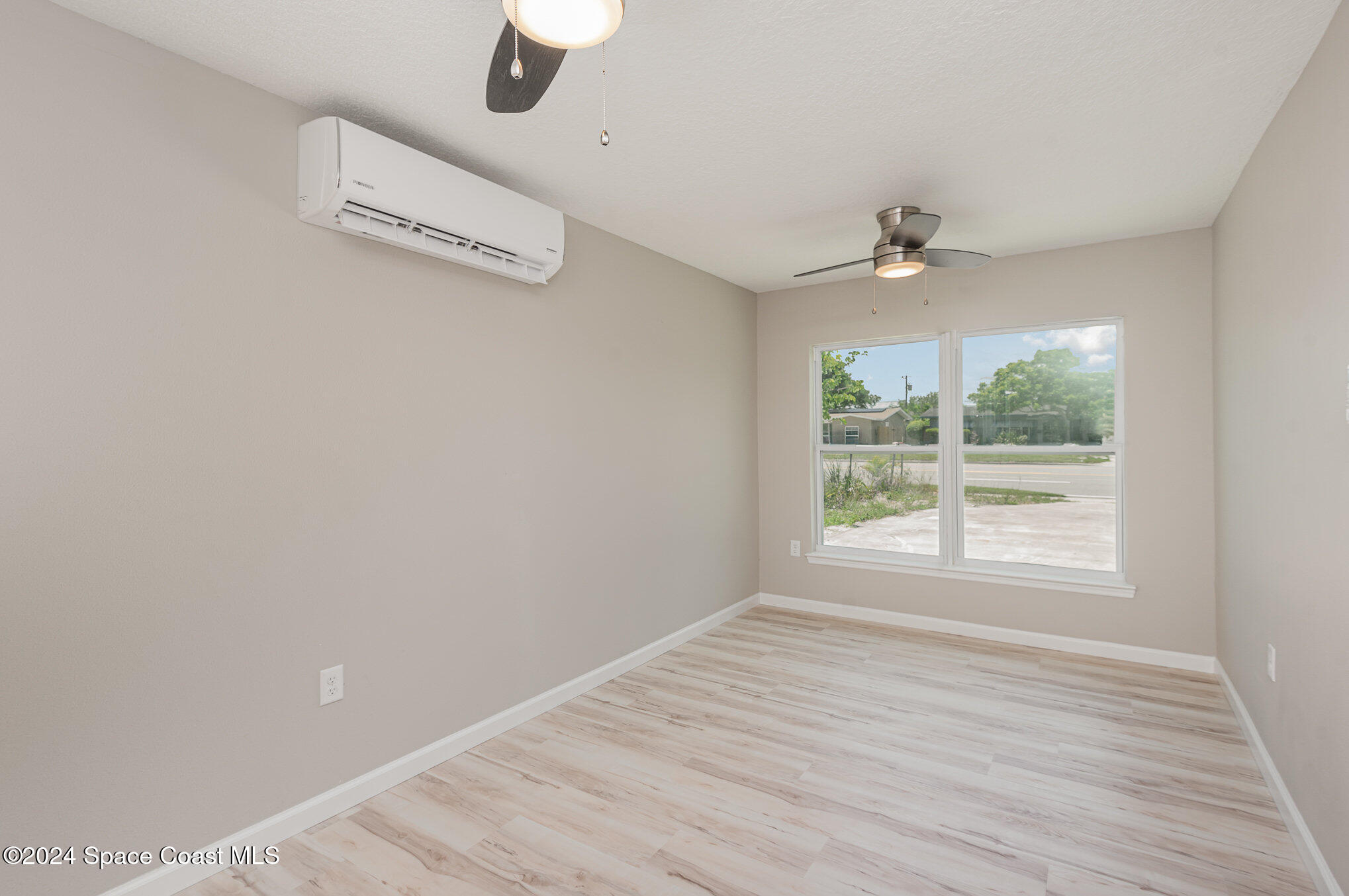 2626 Sarno Road Melbourne, FL 32935 - Photo 5 of 24 a view of an empty room with a window